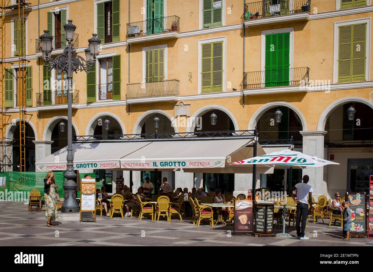 Tables and chairs outside a restaurant in the city of Palma, Mallorca, Balearic Islands, Spain. Stock Photo