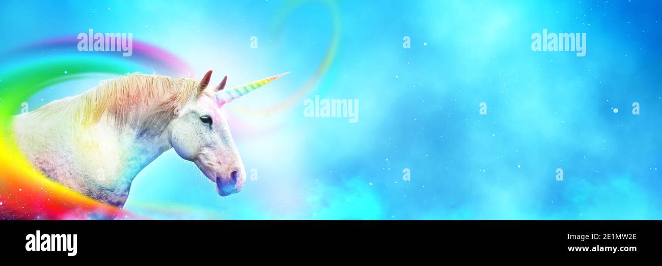 Ancient mythical unicorn with colorful rainbow. Panoramic style with wide copy space. Stock Photo