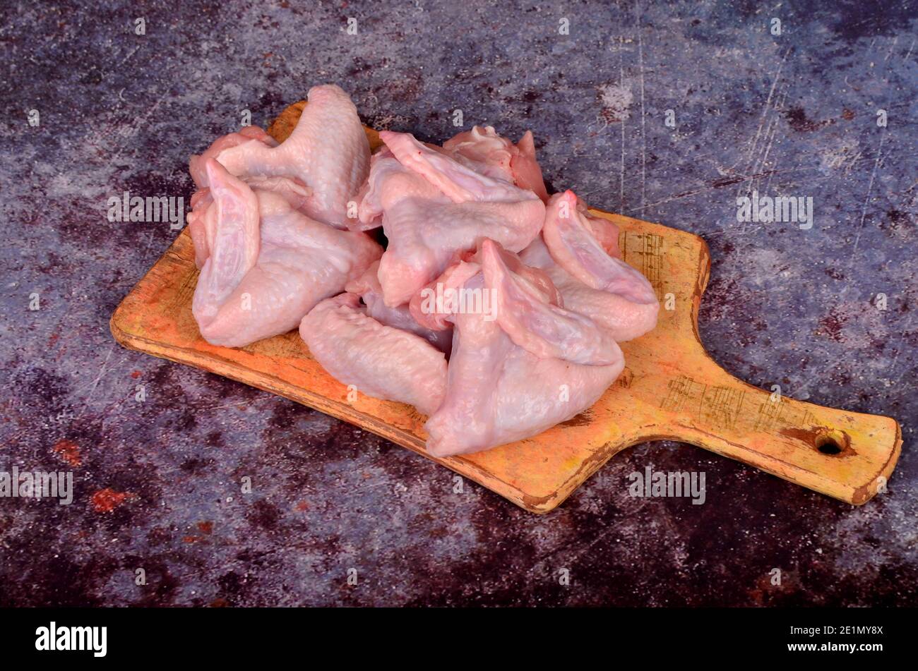 Raw turkey wings on black Slate Tray. Fresh turkey wingette on a black  stone tray Stock Photo - Alamy