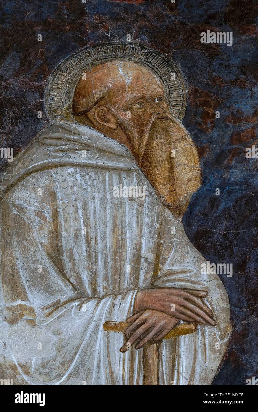 Saint Romuald or San Romualdo, founder in the 1000s of the Camaldolese monastic order.  Detail of 1400s Crucifixion fresco, attributed to Florentine Late Gothic and Renaissance artist Stefano d’Antonio di Vanni (c. 1405-1483), a pupil of painter and sculptor Bicci di Lorenzo (1373-1452).  In the Chiesa di Sant’Agostino in Volterra, Tuscany, Italy. Stock Photo