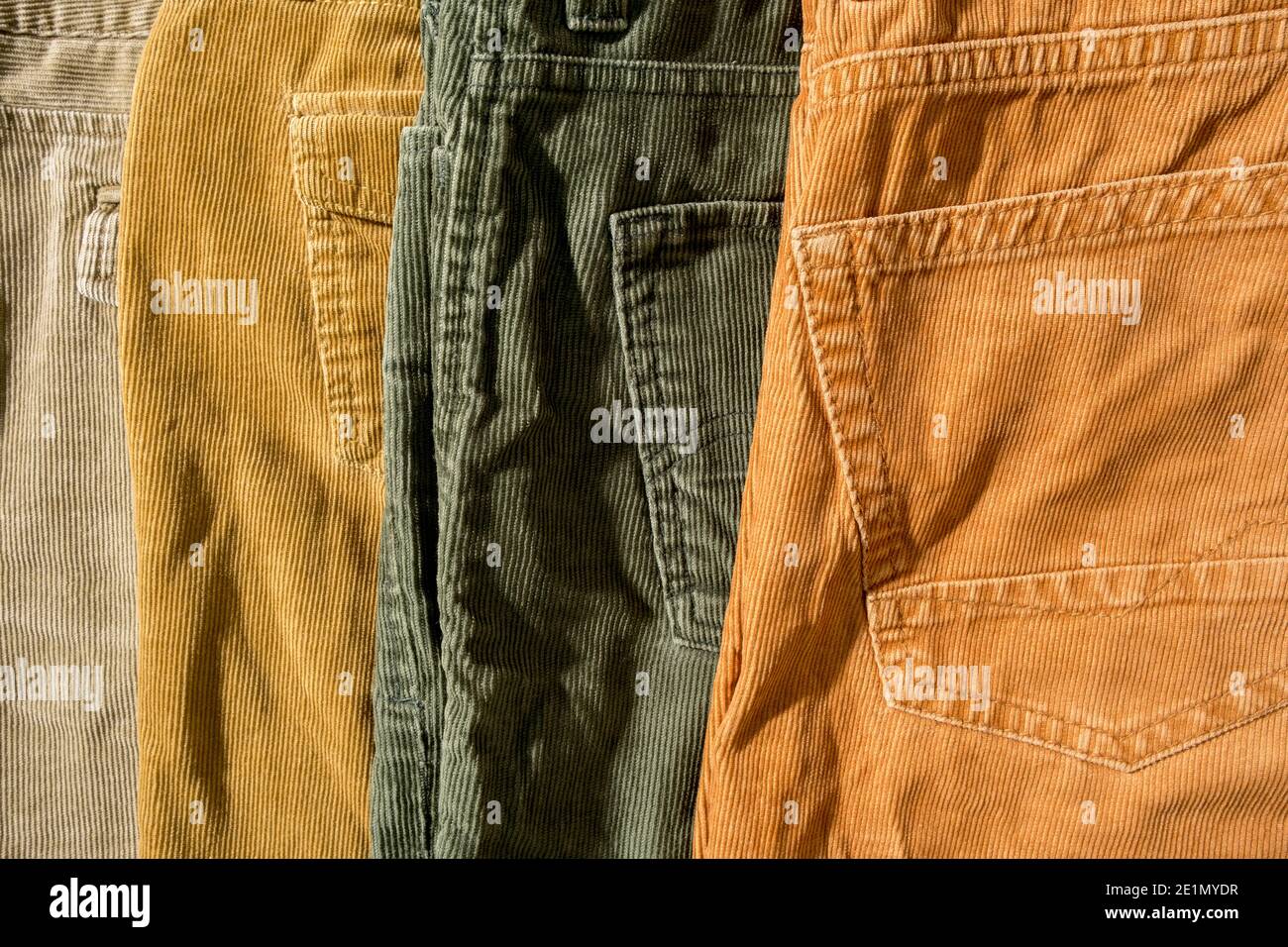 Neatly folded corduroy trousers, on sale. Shopping.  Stock Photo