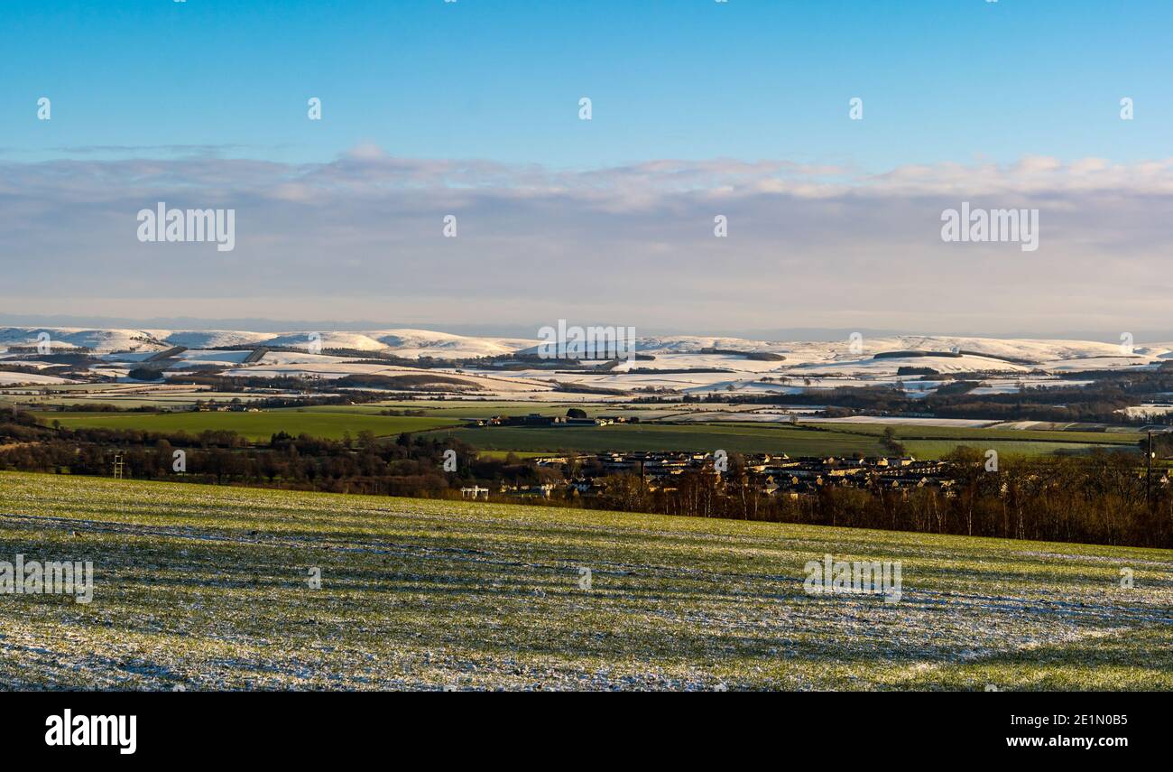 East Lothian, Scotland, United Kingdom, 8th January 2021. UK Weather: snow covers most of the county from the Garleton Hills southwards to the Lammermuir Hills, here overlooking Haddington on a bright clear sunny day Stock Photo