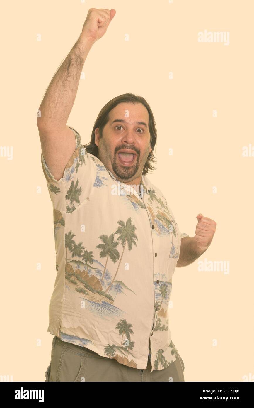 Happy fat Caucasian man smiling and looking excited ready for vacation Stock Photo