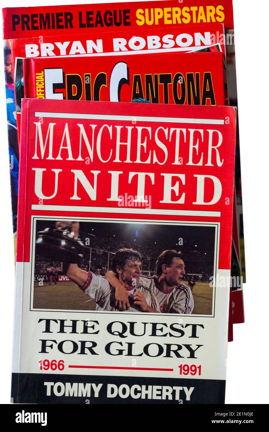 pile of well used Manchester United football books with Manchester United The Quest for Glory 1966-1991 book on top Stock Photo