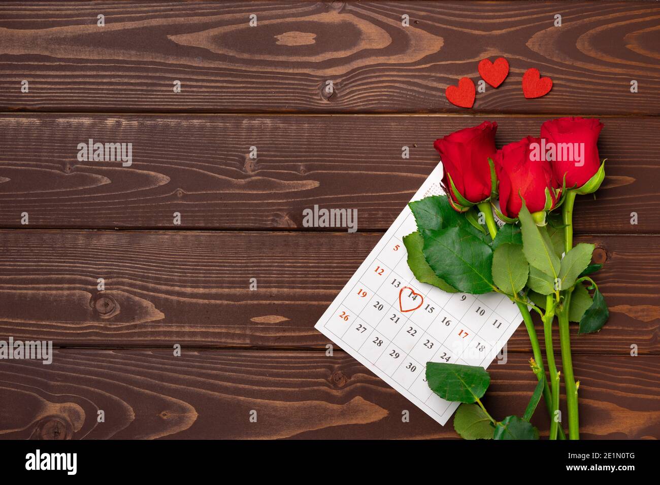 February calendar and red roses top view Stock Photo - Alamy