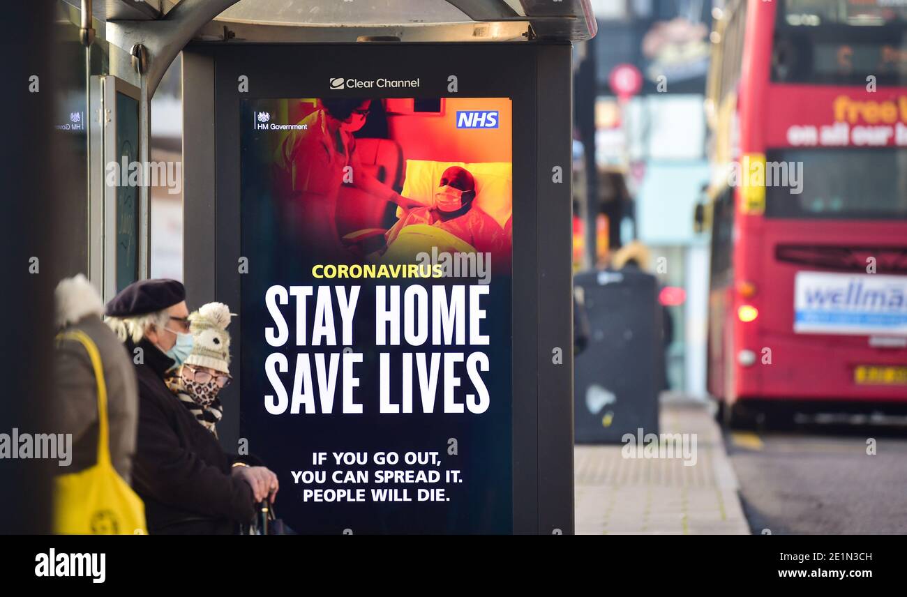Brighton UK 8th January 2021 - A 'Stay Home Save Lives' coronavirus poster in a bus stop in Brighton as the coronavirus COVID-19 lockdown restrictions continue in England  : Credit Simon Dack / Alamy Live News Stock Photo
