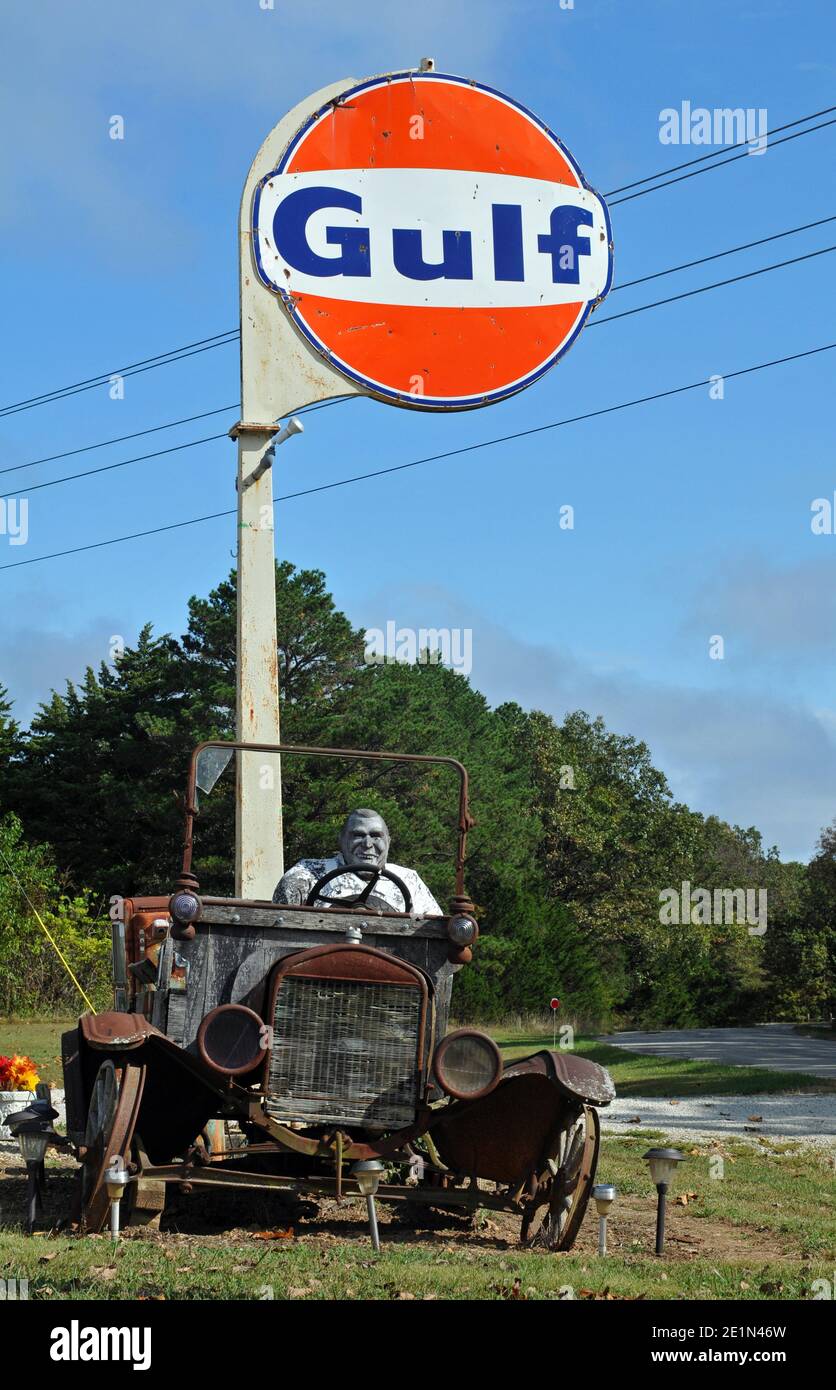 An antique car and Gulf sign stand at Bob's Gasoline Alley, a collection of antique gas station memorabilia near Cuba, Missouri that closed in 2020. Stock Photo