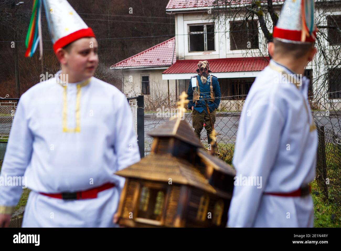 Non Exclusive: TURYCHKY, UKRAINE - JANUARY 7, 2021 - A caroller representing the devil is part of the band that goes to the houses of the villagers co Stock Photo