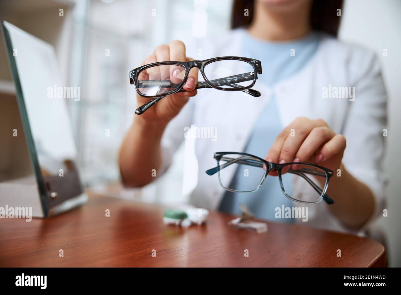 Medical worker providing two variants of glasses Stock Photo Alamy