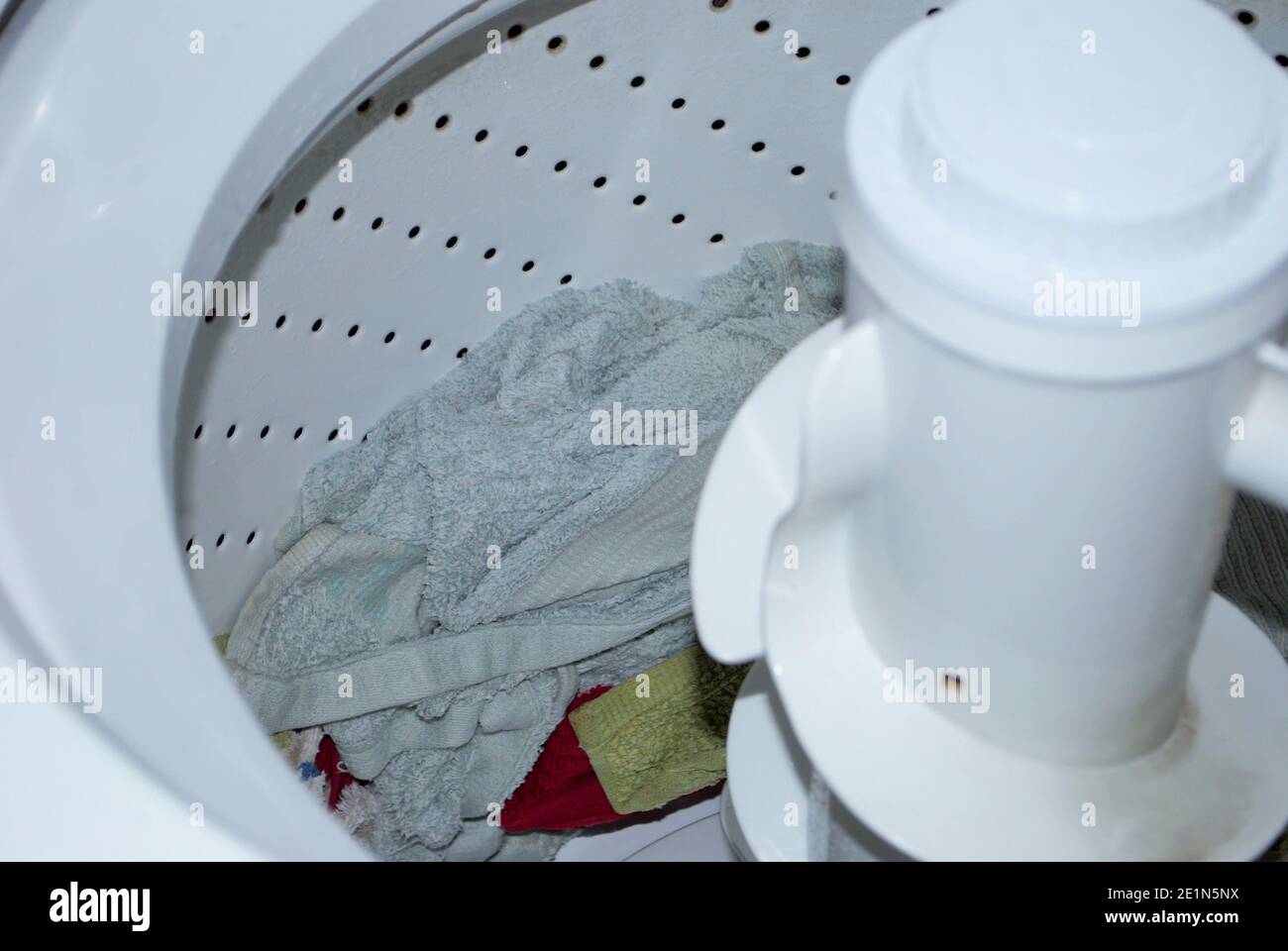 load of towels in a washing machine after the wash cycle is finished