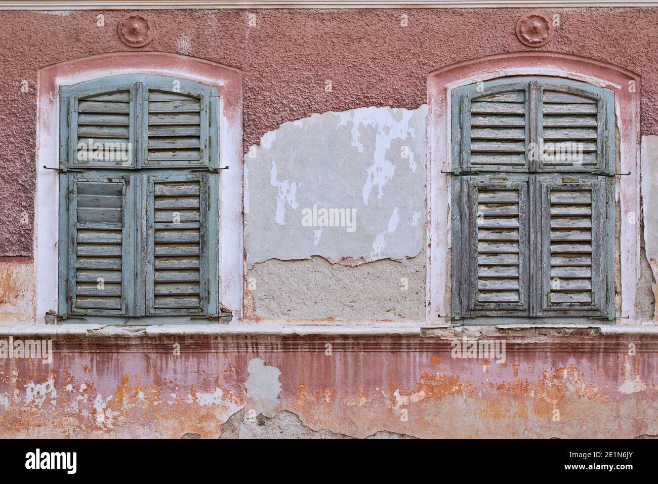 windows with shutters on abandoned traditional house, rchitectural background Stock Photo