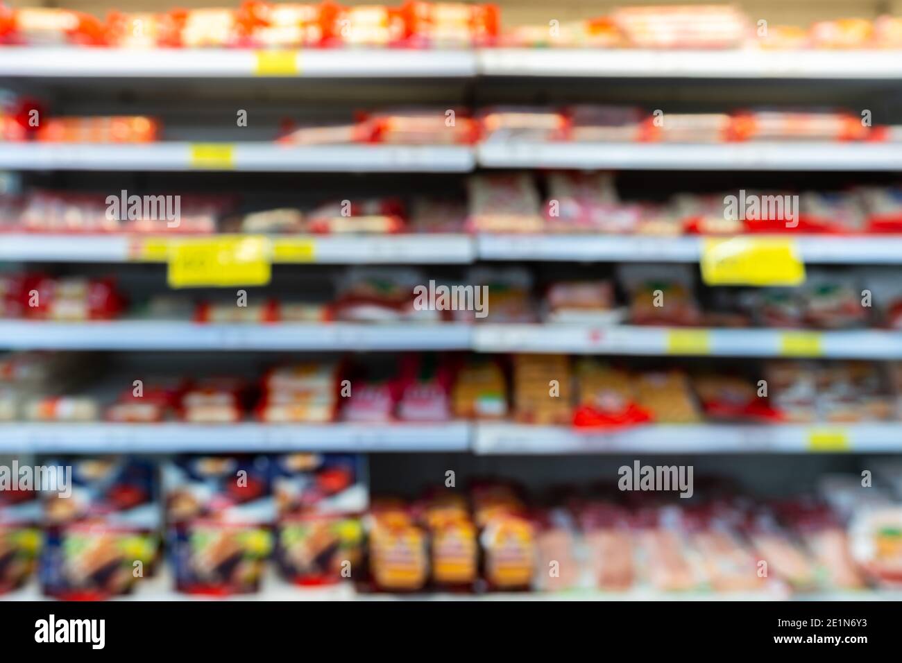 Blur image of shelf with consumer product shop in supermarket Stock Photo