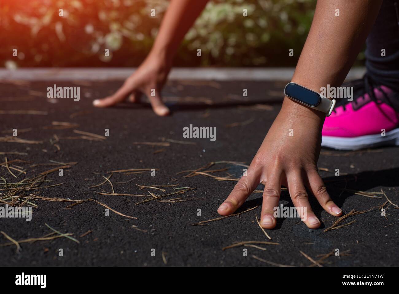 Runner start position. Closeup of runner's hands on start position ...