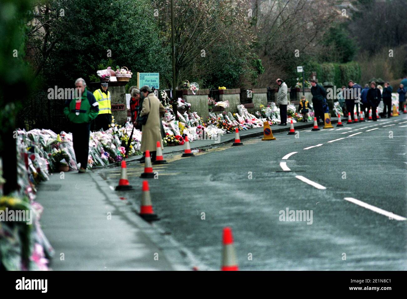 Dunblane School Massacre 13 March 1996. Photos take 14 march onwards. Wikipedia below: The Dunblane massacre took place at Dunblane Primary School near Stirling, Scotland, United Kingdom, on 13 March 1996, when Thomas Hamilton shot sixteen pupils and one teacher dead, and injured fifteen others, before killing himself. It remains the deadliest mass shooting in British history. Public debate about the killings centred on gun control laws, including public petitions for a ban on private ownership of handguns and an official inquiry, which produced the 1996 Cullen Report. Stock Photo