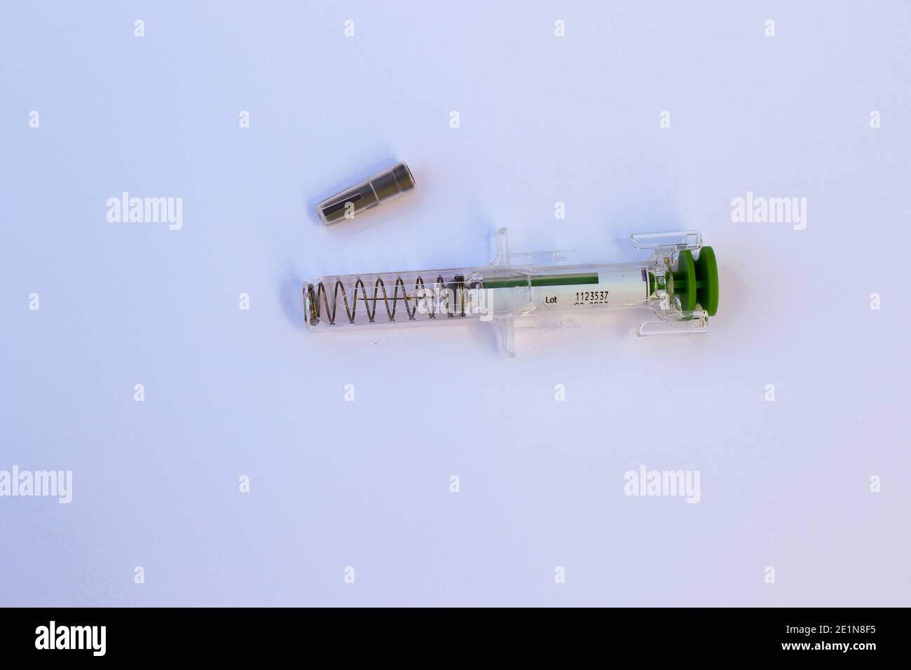 Used injection syringe needle with safety spring needle guard and
