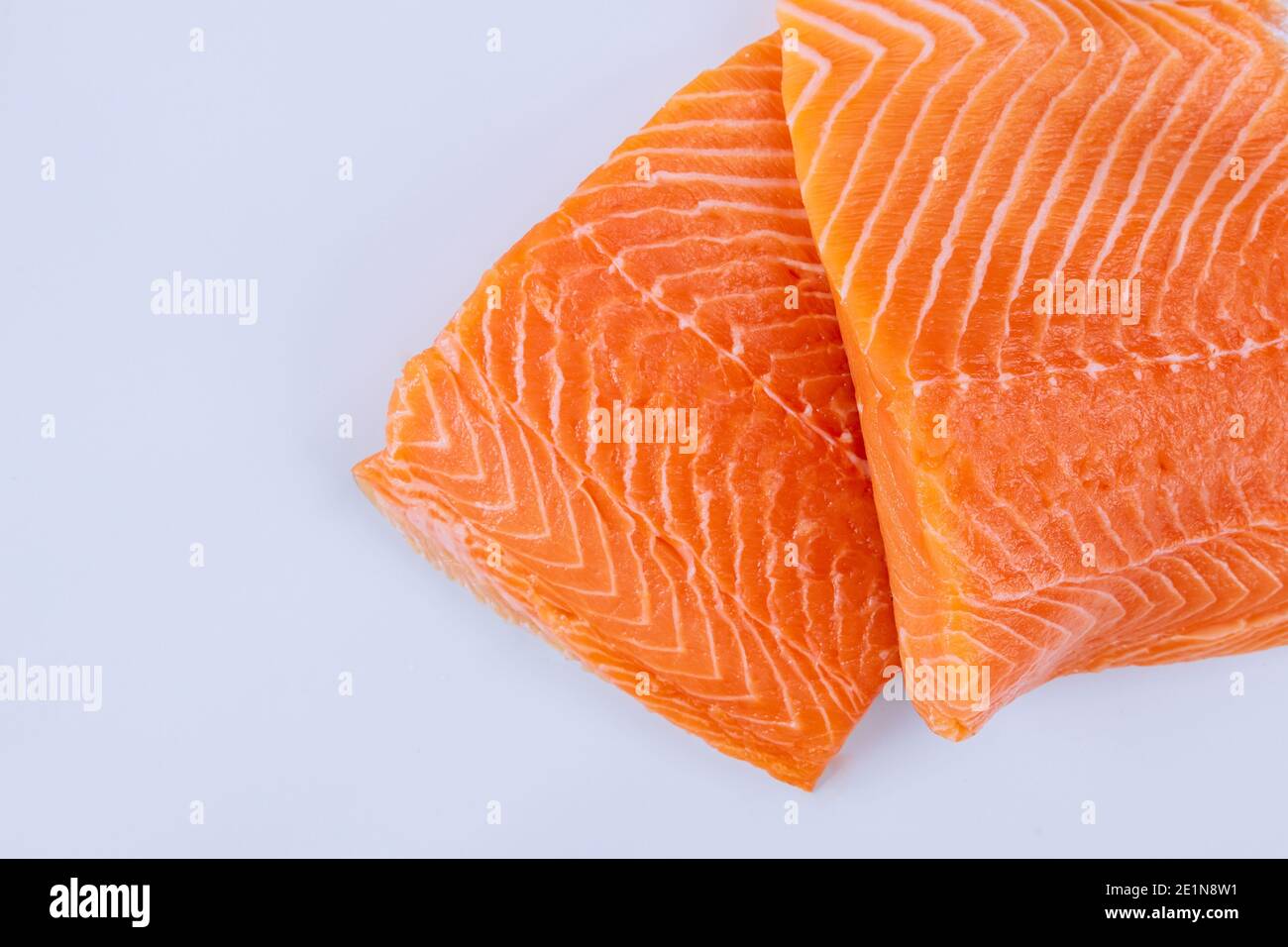 Two fresh raw salmon fillet with on a isolated white background Stock ...