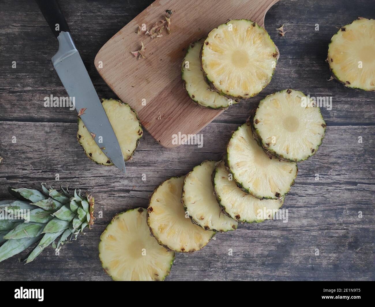 Sliced and chopped pineapple on a dark background Stock Photo