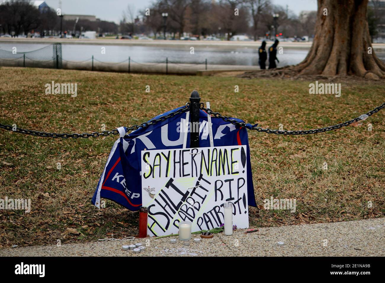 A makeshift memorial in memory of Ashli Babbitt, who was killed during Wednesday's assault on the U.S. Capitol by a mob seeking to overturn President Donald Trump's election loss, sits near a Trump 2020 campaign banner on the Capitol grounds days after Trump supporters stormed the building in Washington, U.S., January 8, 2021. REUTERS/Carlos Barria Stock Photo
