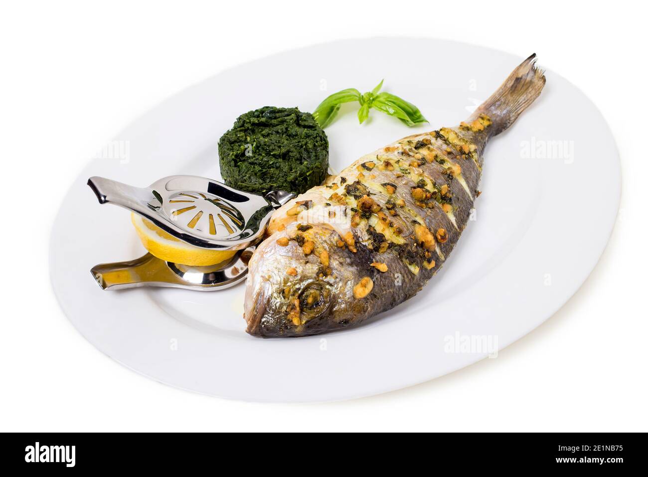 Cooked fish sea bream fish with lemon.Isolated in a white background. Close-up. Stock Photo