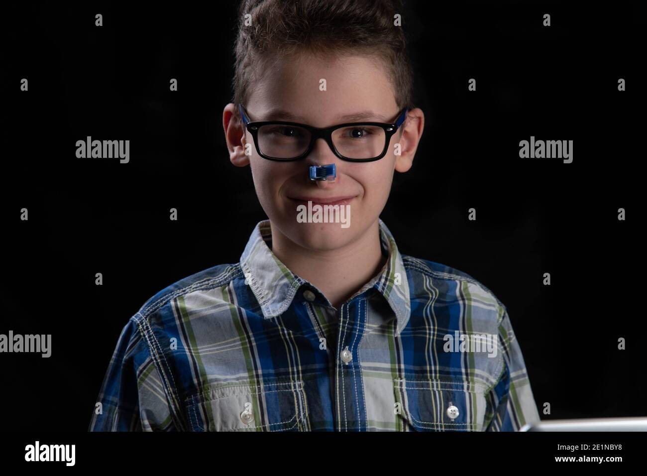 Boy funny with clothespin on nose Stock Photo Alamy