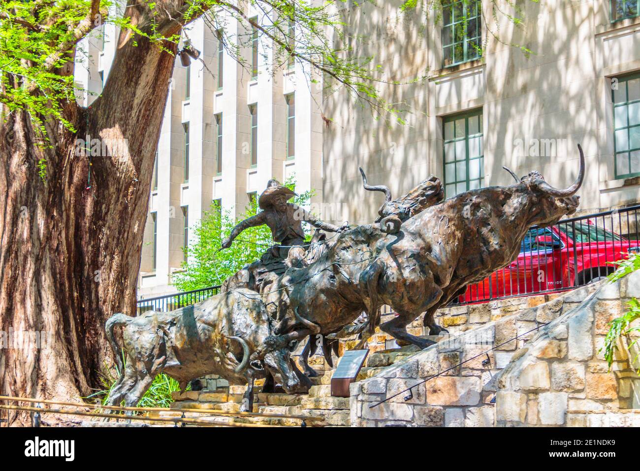 San Antonio, Texas, USA - March 29, 2018:   Three  ton T.D. Kelsey sculpture, Coming Home to the Briscoe, depicting a vaquero driving longhorns on a c Stock Photo