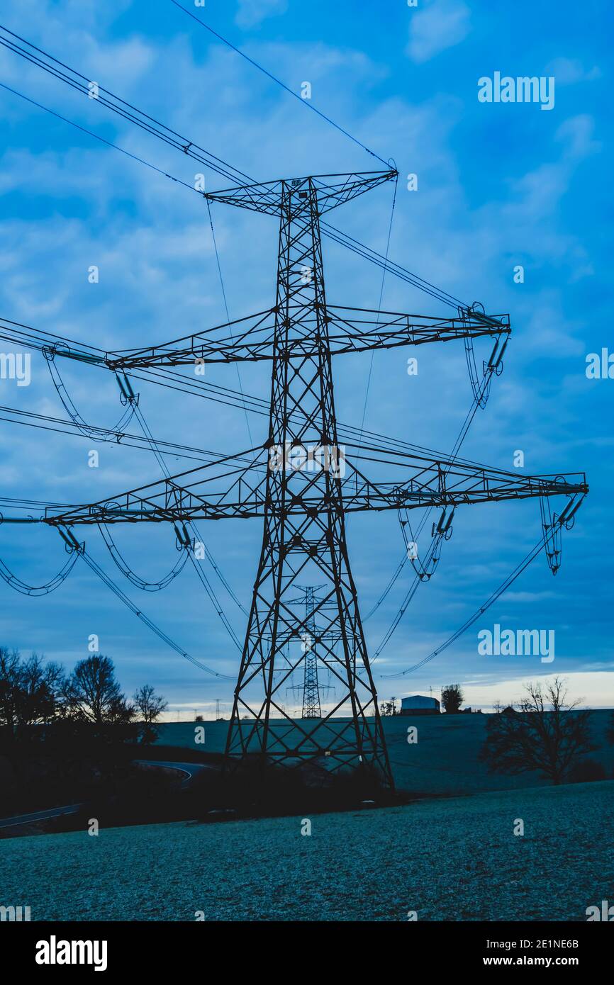 high voltage post,High voltage tower sky surise background Stock Photo