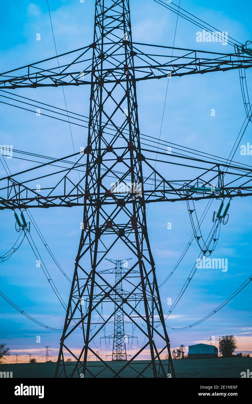 high voltage post,High voltage tower sky surise background Stock Photo