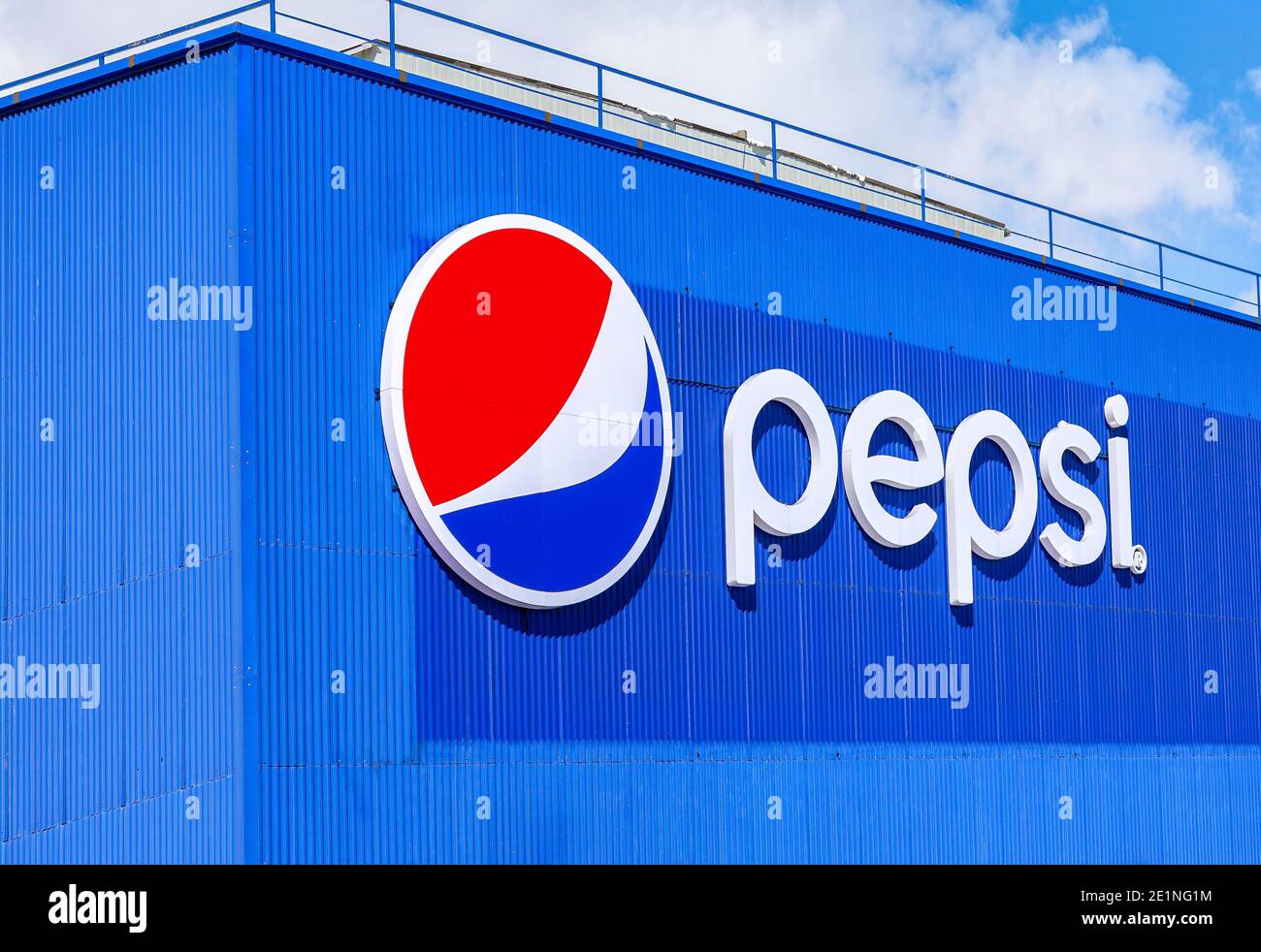Samara, Russia - March 20, 2016: Brand name of Pepsi Corporation on the wall of factory. PepsiCo Inc. is an American multinational food, snack and bev Stock Photo