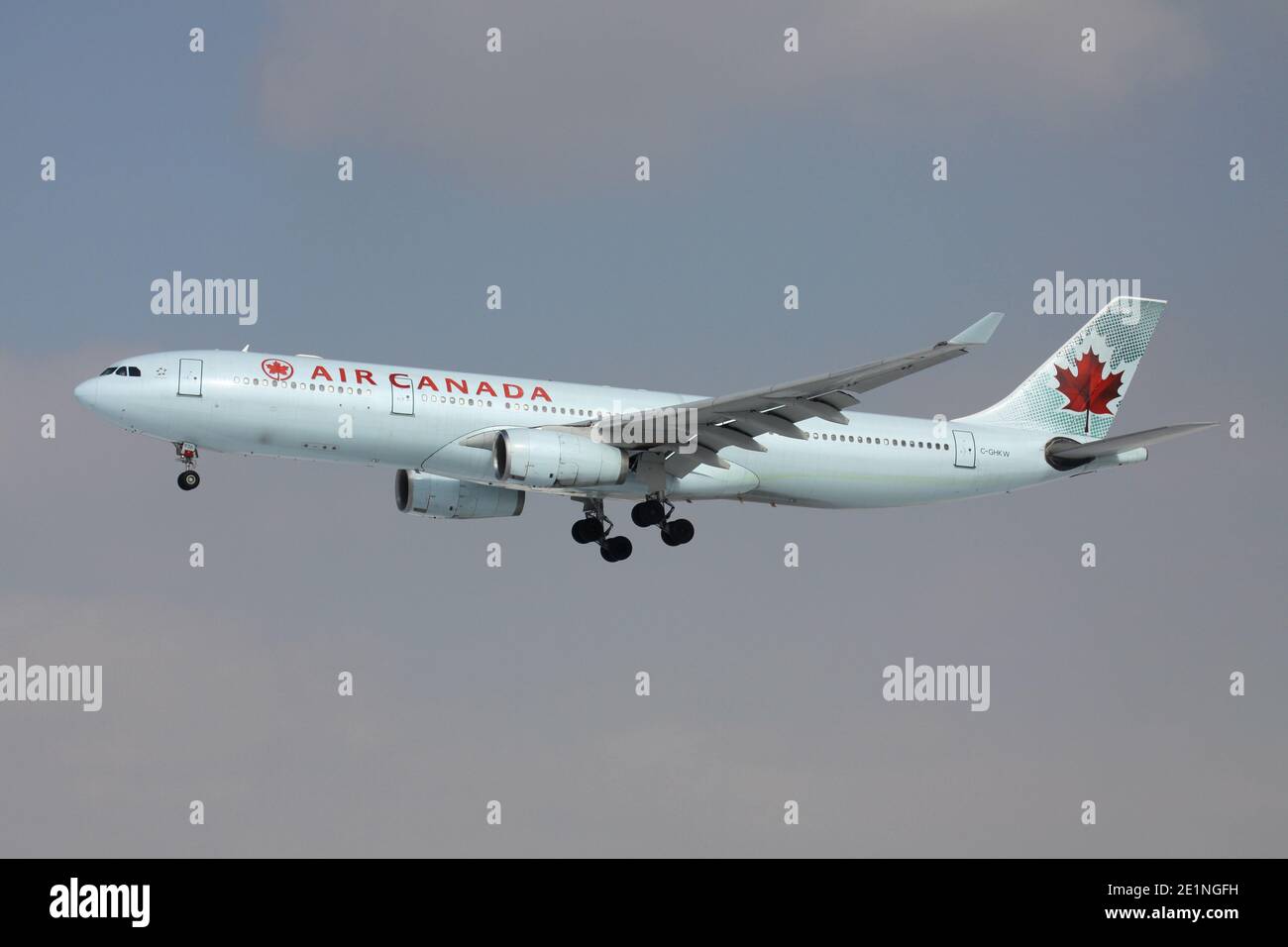 Air Canada Airbus A330-300 with registration C-GHKW on short final for runway 25L of Frankfurt Airport. Stock Photo