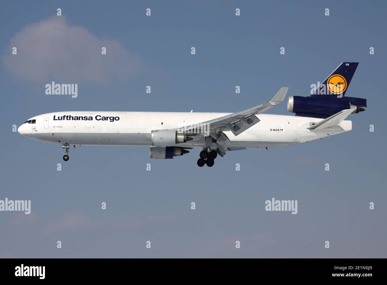 German Lufthansa Cargo McDonnell Douglas MD-11F with registration D-ALCS on short final for runway 25L of Frankfurt Airport. Stock Photo