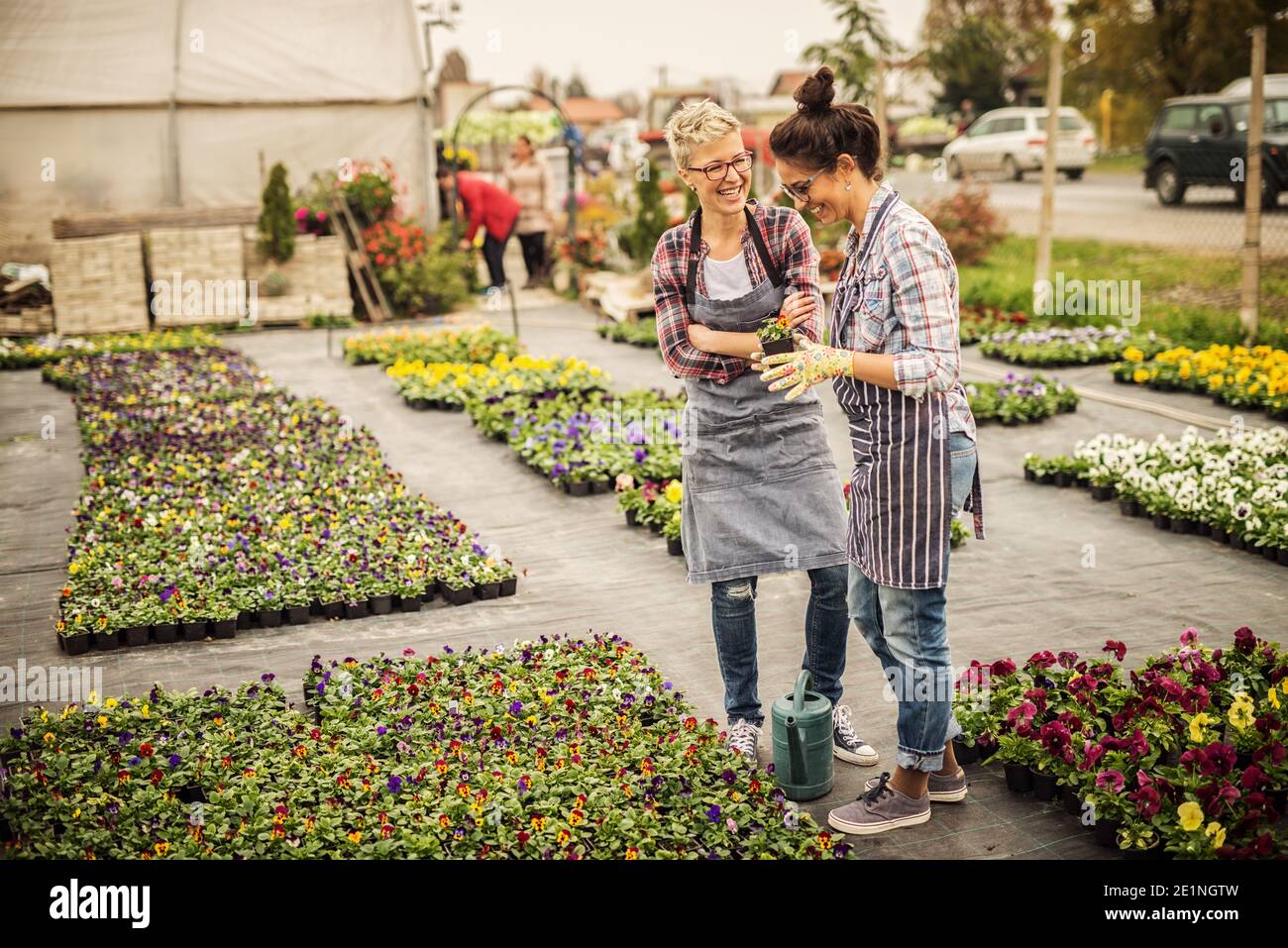 Girl checking plants in pots hi-res stock photography and images - Alamy