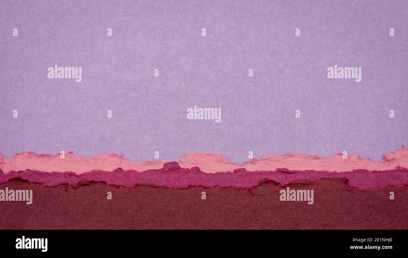 abstract landscape in pink and purple pastel tones created from sheets of handmade textured paper Stock Photo