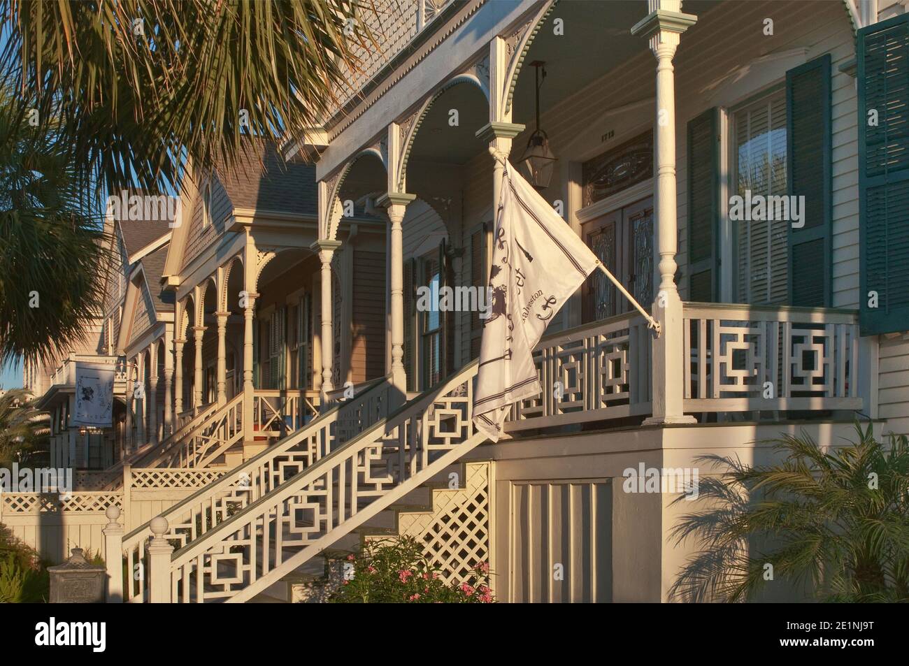Porches of 'gingerbread' houses, Victorian style, at Ball Avenue in East End Historic District, sunset, Galveston, Texas, USA Stock Photo