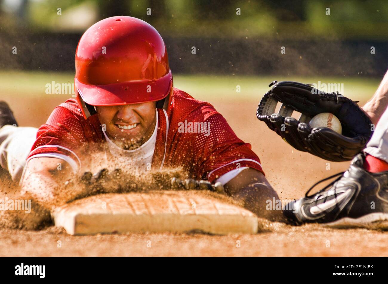 Portrait of man stealing base in baseball Stock Photo Alamy