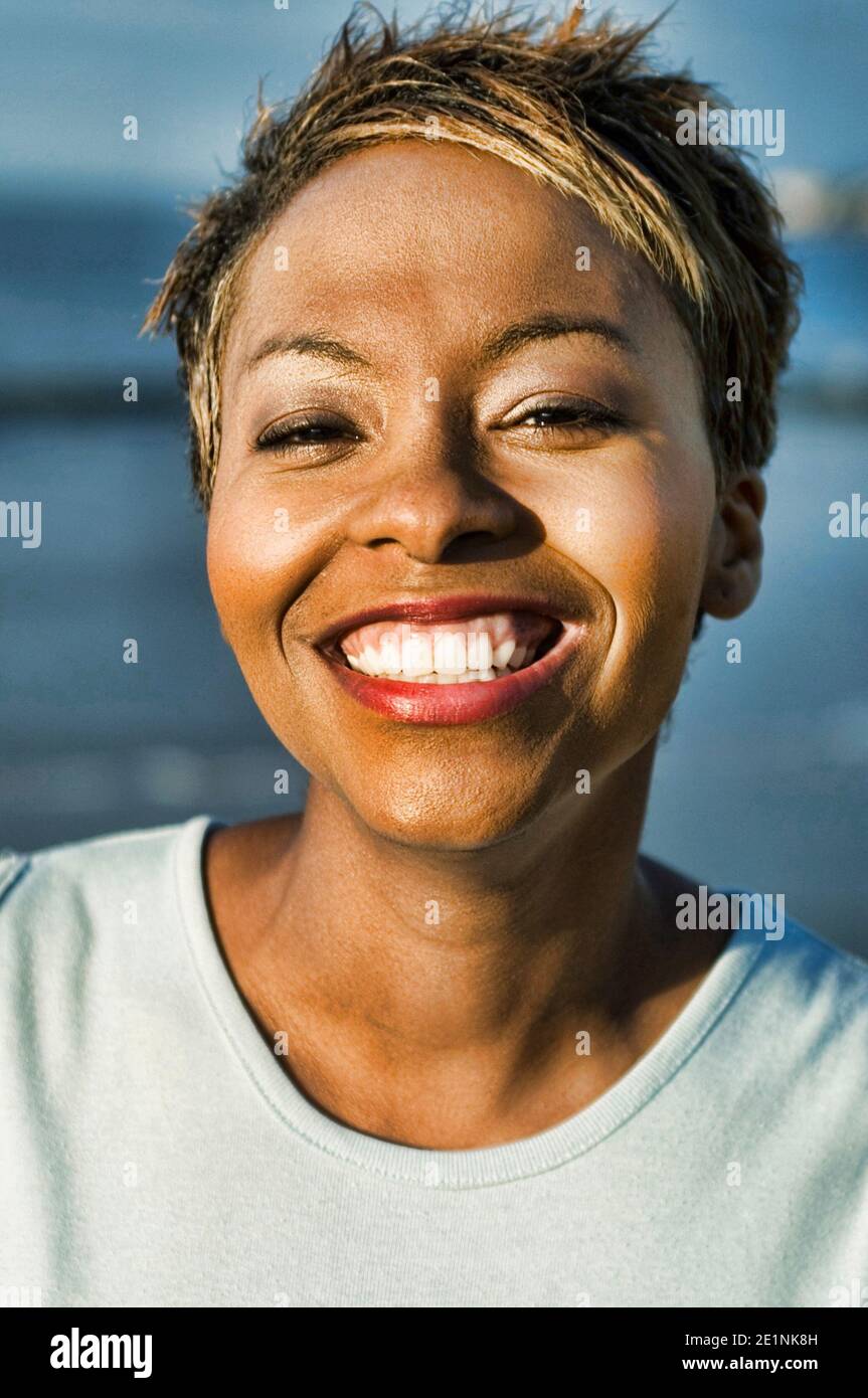 Photo of african woman smiling Stock Photo - Alamy