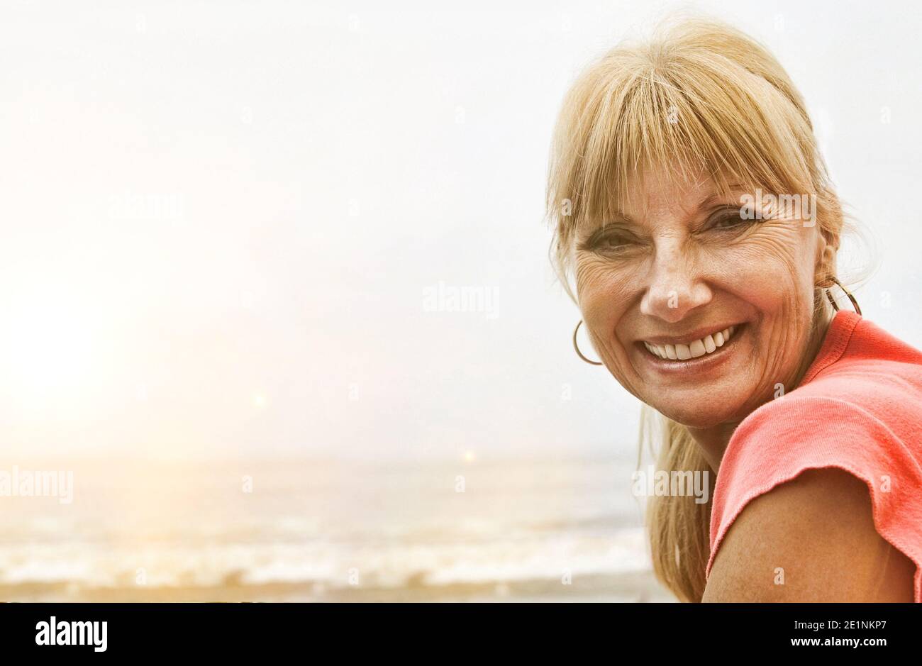 Portrait senior woman smiling at the beach Stock Photo - Alamy