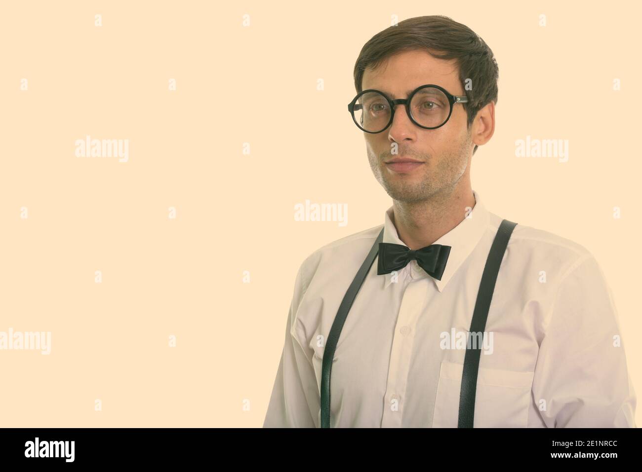 Man With Suspenders And Cap Holding The Tube Stock Photo