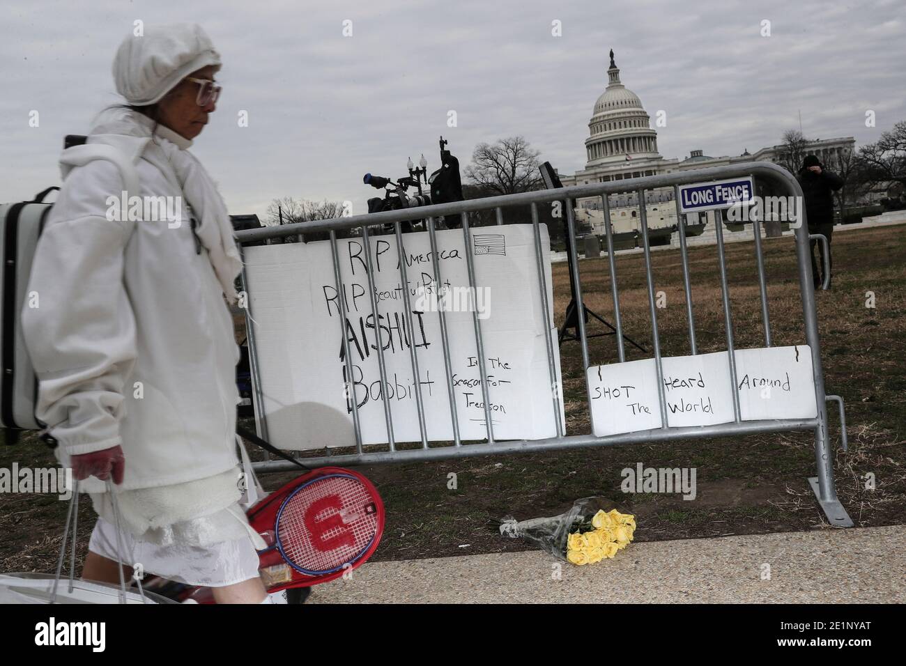 Washington, USA. 08th Jan, 2021. People walk near a make-shrift shrine to Ashli Babbitt, 39, outside the U.S. Capitol on January 08, 2021 in Washington, DC. Babbitt, an Air Force veteran, was shot and killed while storming the Capitol with a pro-Trump mob two days before. (Photo by Oliver Contreras/SIPA USA) Credit: Sipa USA/Alamy Live News Stock Photo