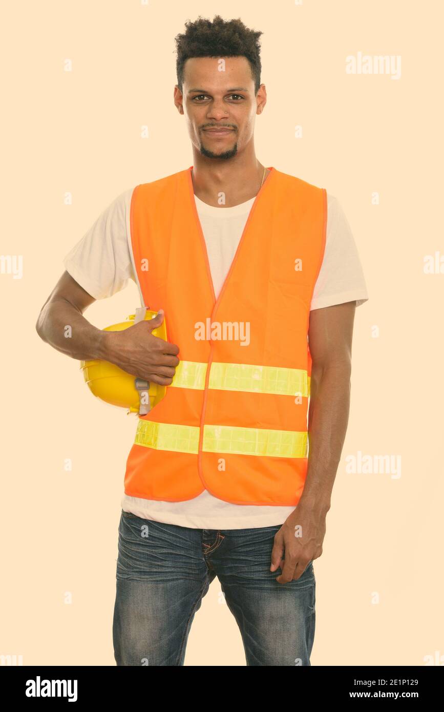 Young African man construction worker holding safety helmet Stock Photo ...