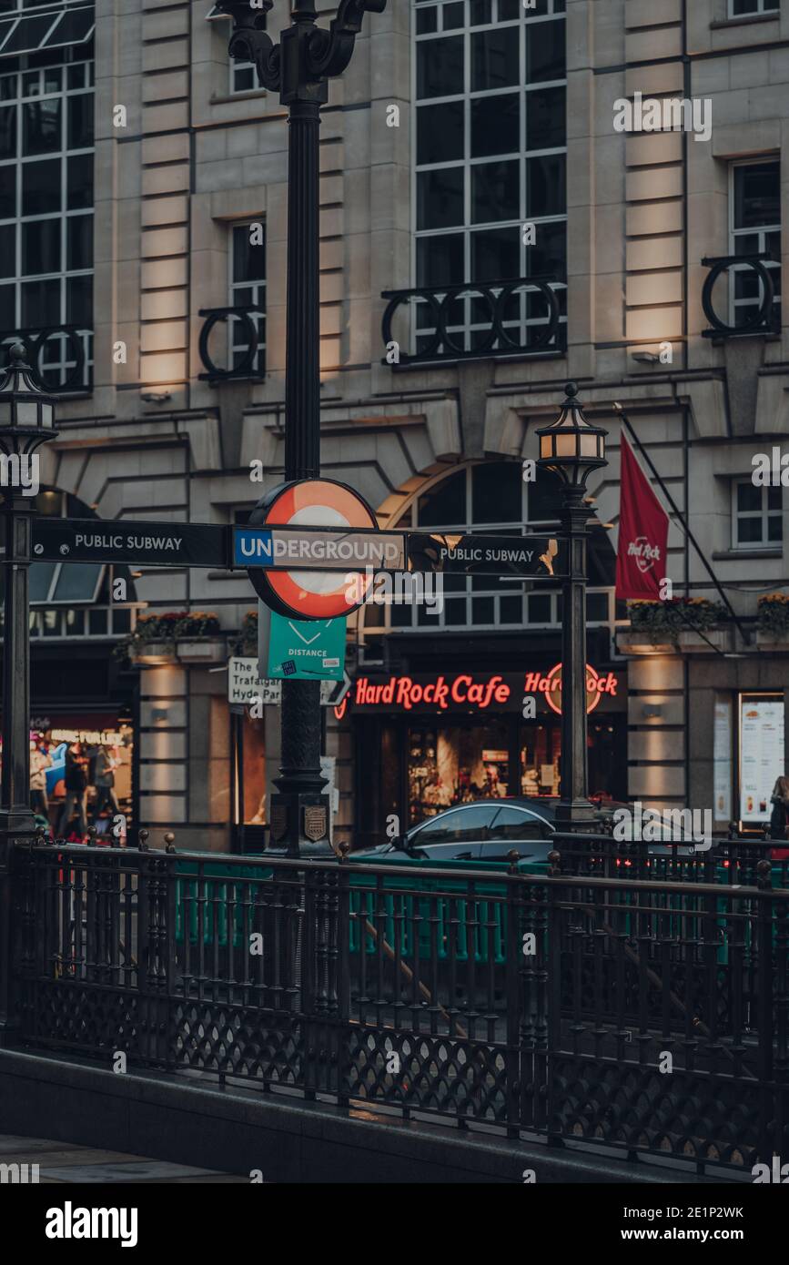 London, UK - November 19, 2020: London Underground sign at the entrance of Piccadilly Circus station, London, at night. London Underground is the olde Stock Photo