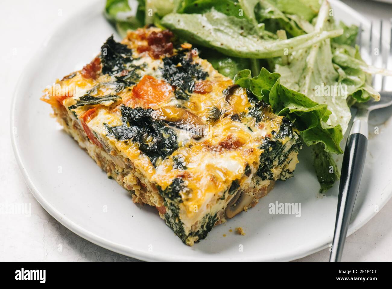 Chorizo egg casserole with side salad Stock Photo Alamy
