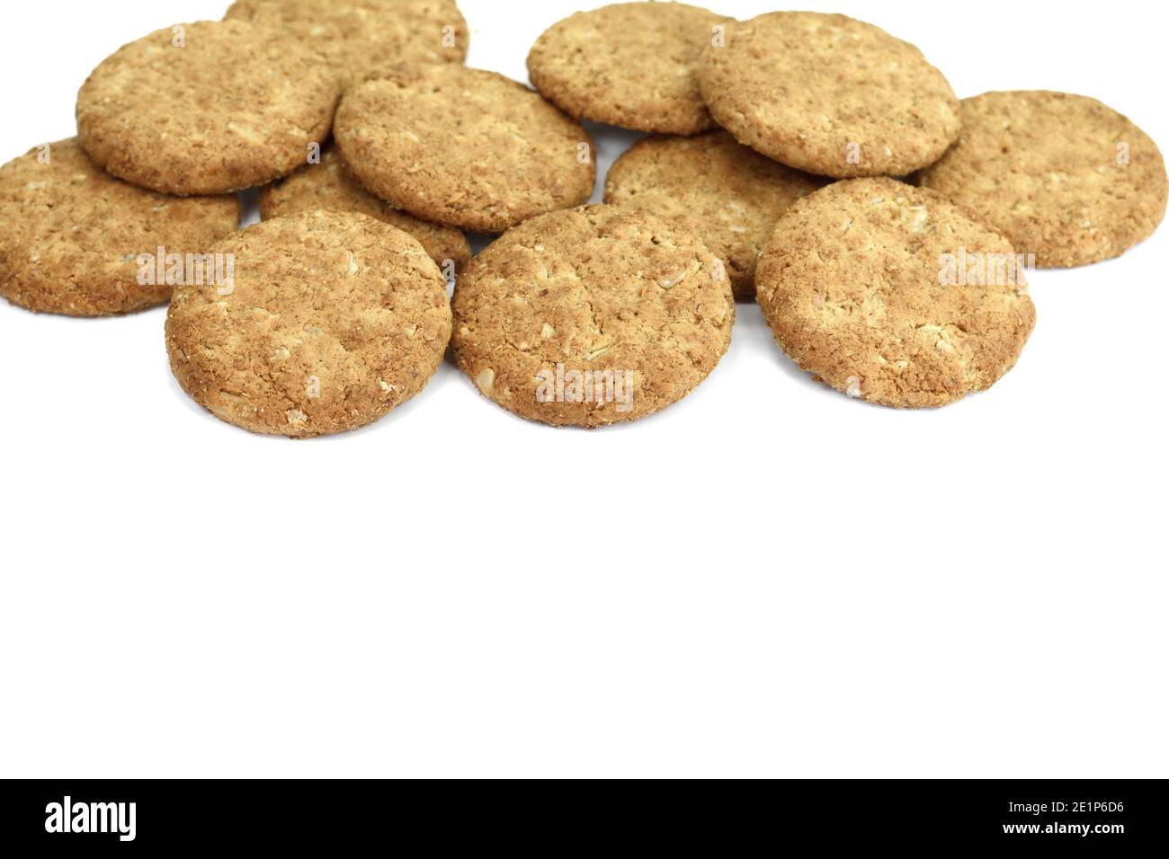 Round whole wheat biscuit, cookie with raisins isolated on white background. Biscuits with whole