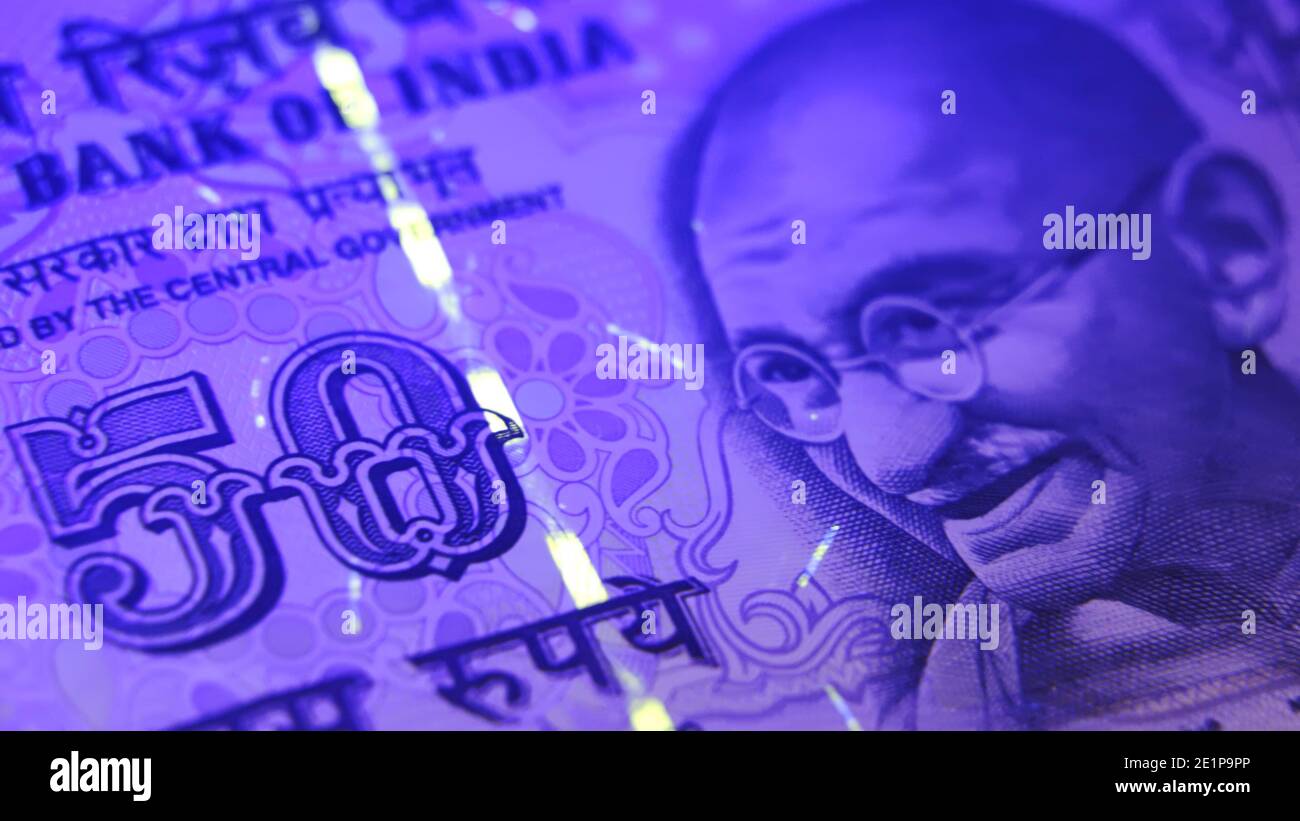 Warsaw, Poland 01.01.2021 Indian Rupees paper banknotes being counted. The Gandhi Series of banknotes issued by the Reserve Bank of India (RBI) extreme close up shot . High quality photo Stock Photo