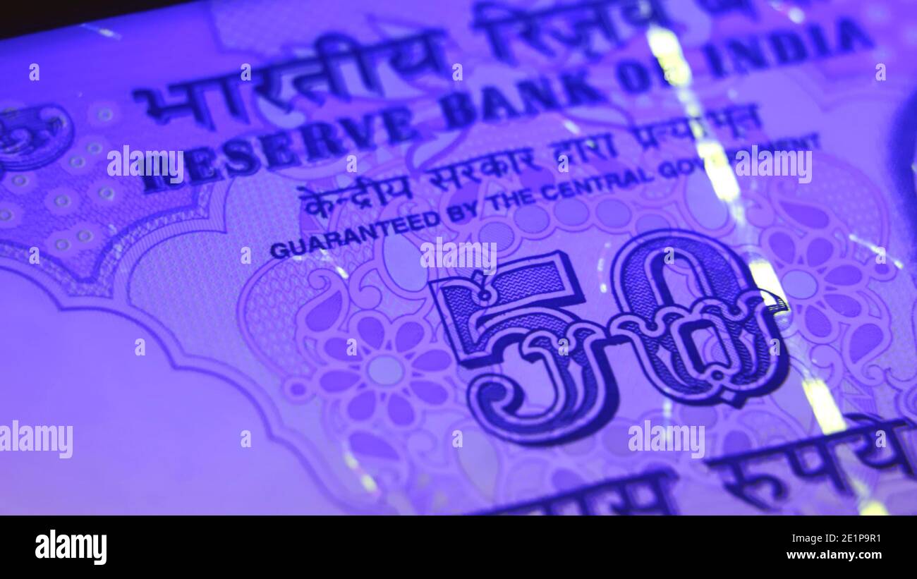 Warsaw, Poland 01.01.2021 Indian Rupees paper banknotes being counted. The Gandhi Series of banknotes issued by the Reserve Bank of India (RBI) extreme close up shot . High quality photo Stock Photo