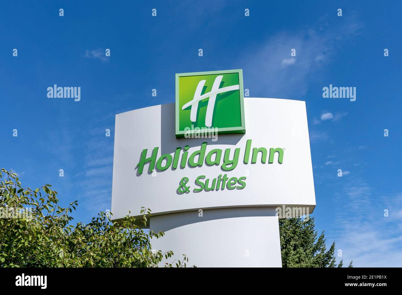 Mississauga, Ontario, Canada- September 19, 2020: Close up of Holiday Inn sign with blue sky in background is seen in Mississauga, Ontario, Canada. Stock Photo