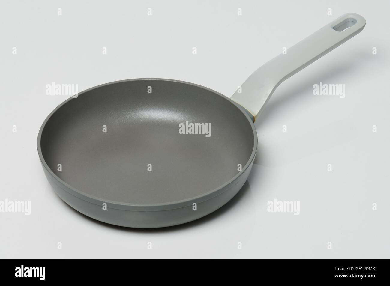 Ceramic gray cooking pan with handle isolated Stock Photo