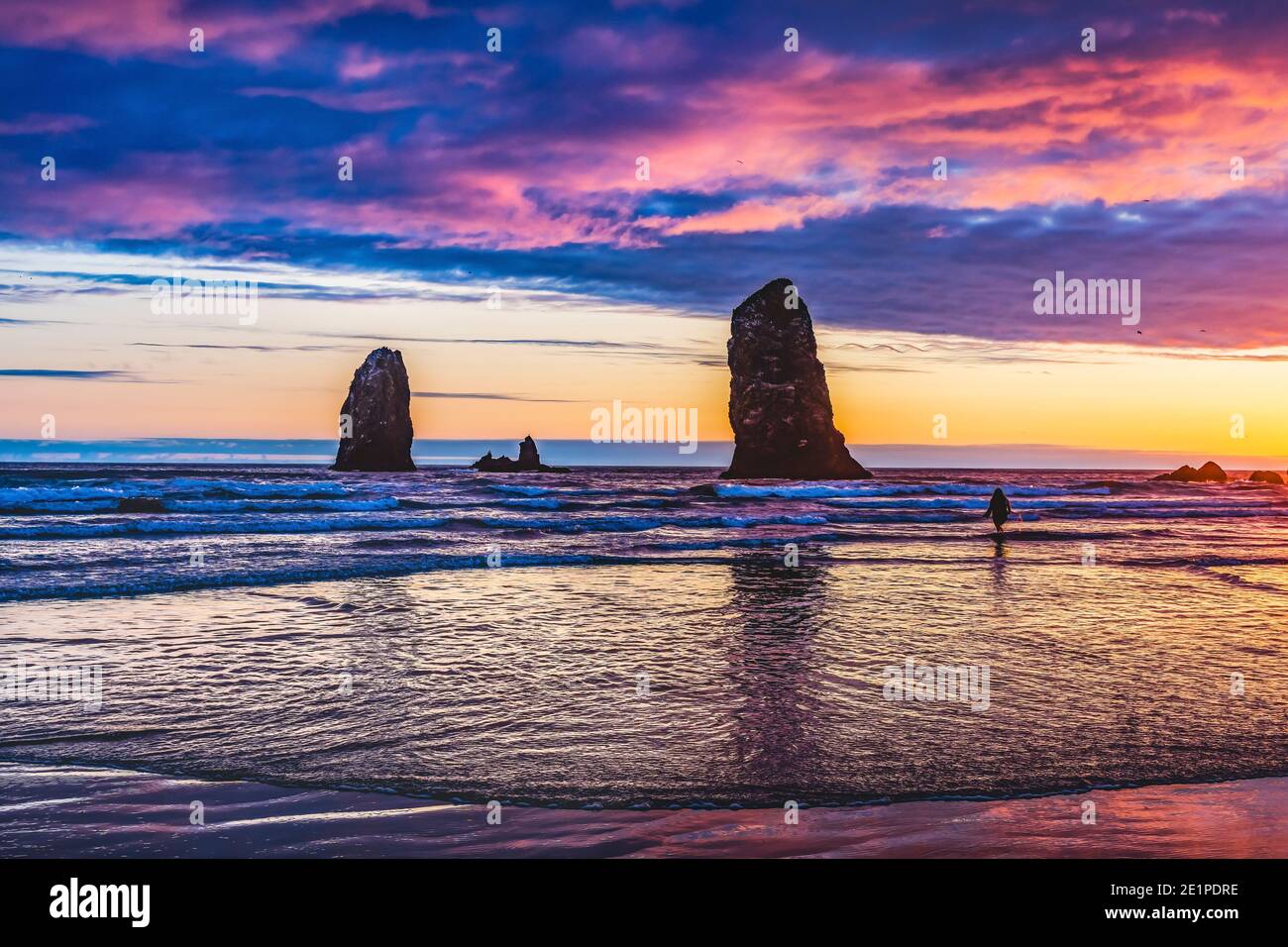 Colorful Sunset Sea Stacks Canon Beach Clatsap County Oregon.  Orginally discovered by Clark of Lewis Clark in 1805 Stock Photo