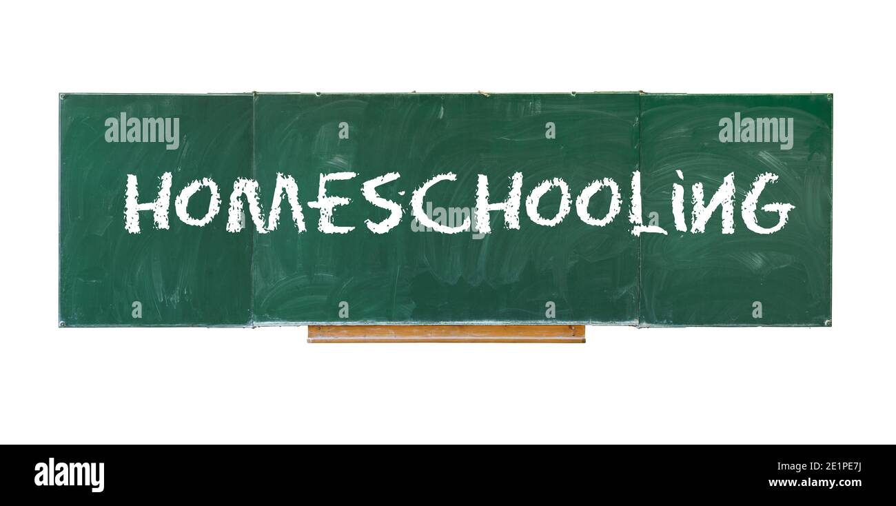 Homeschooling. Word Homeschooling writing on old green blackboard isolated on white background Stock Photo