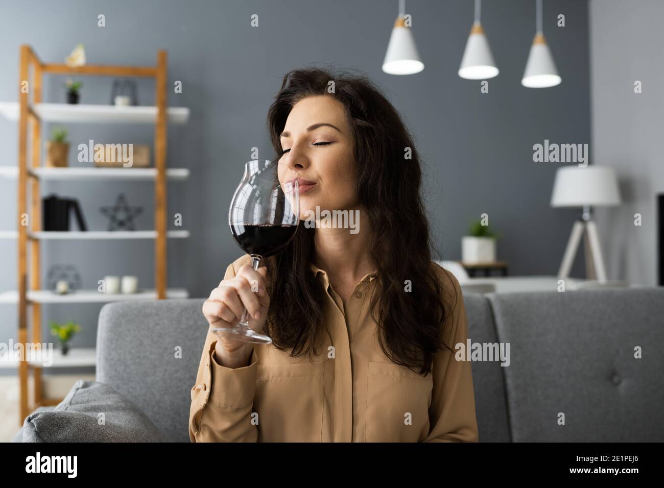 Woman Drinking Red Wine In Video Conference At Home Stock Photo - Alamy