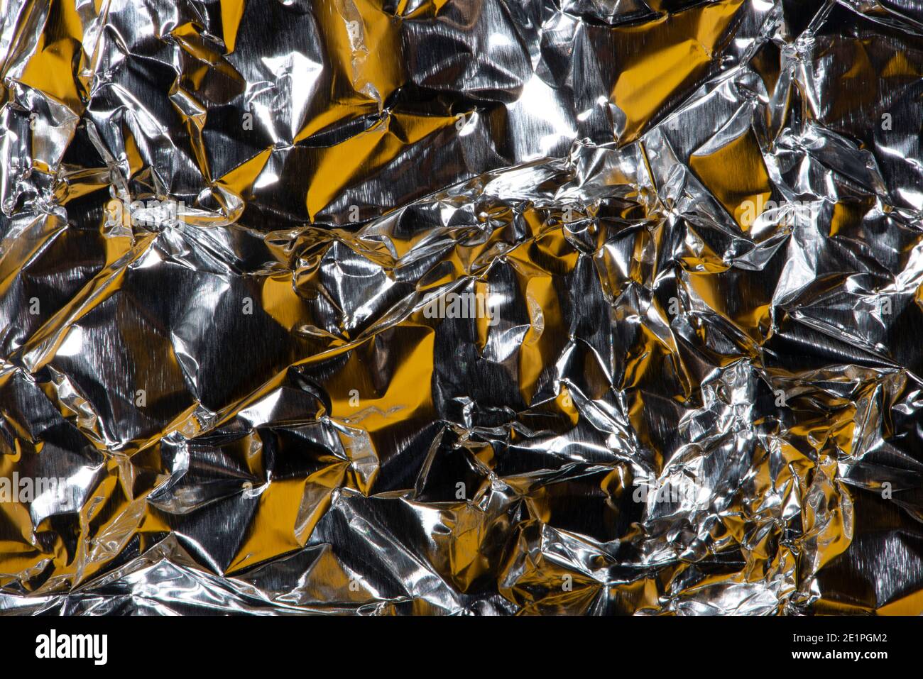 Gold crumpled foil background, banner. Aluminum foil as background